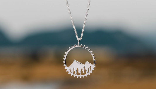 amore mountain bike necklace silver circle mountain necklace with mountains in background