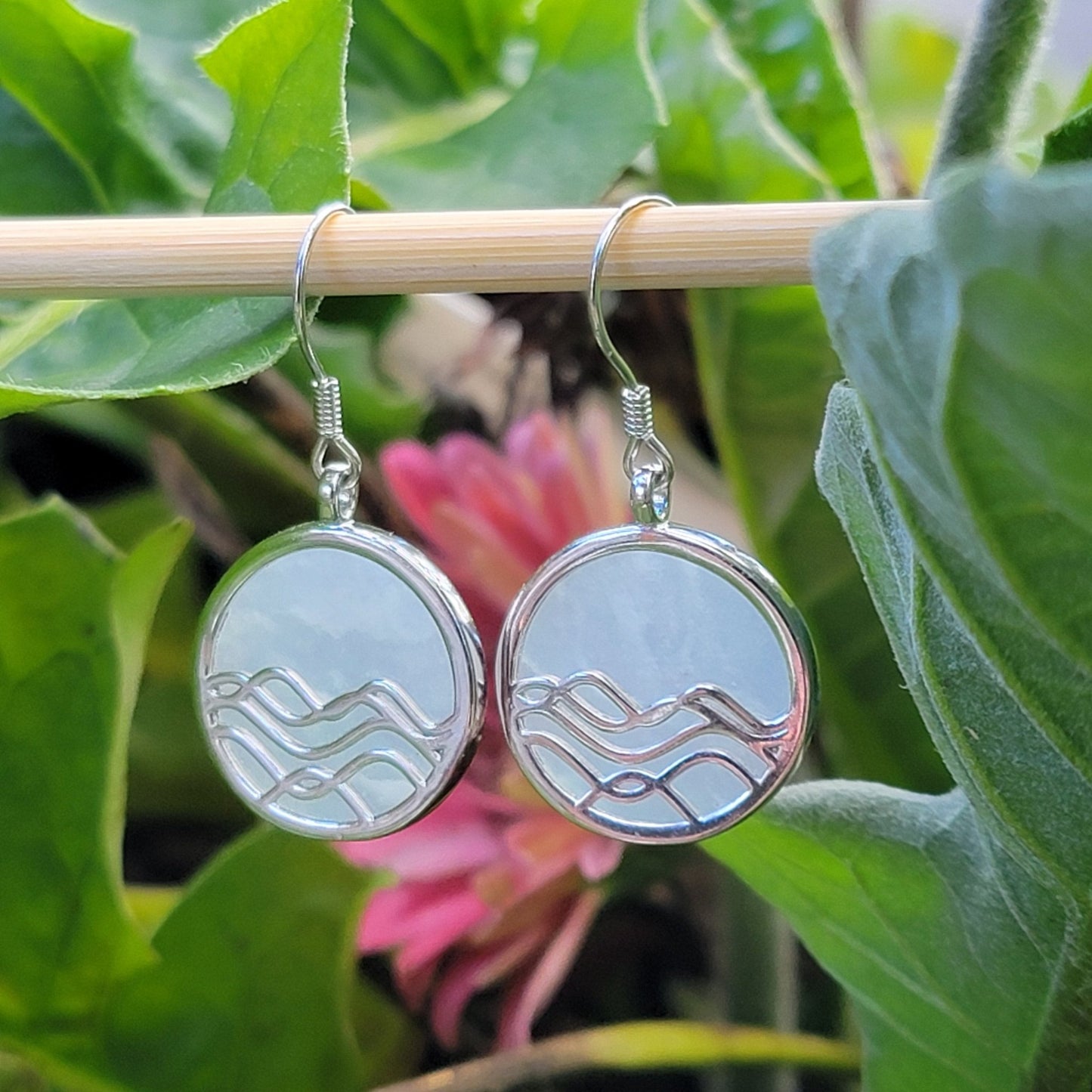 amazonite gemstone earrings. silver dangle earrings with ocean wave design amongst flowers