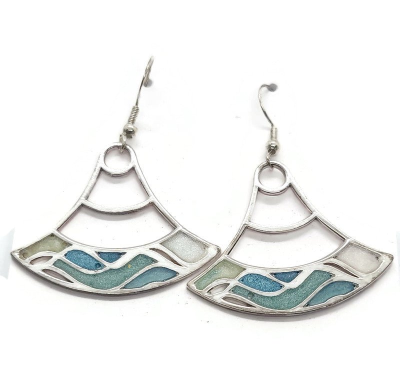 close up of blue statement wave earrings