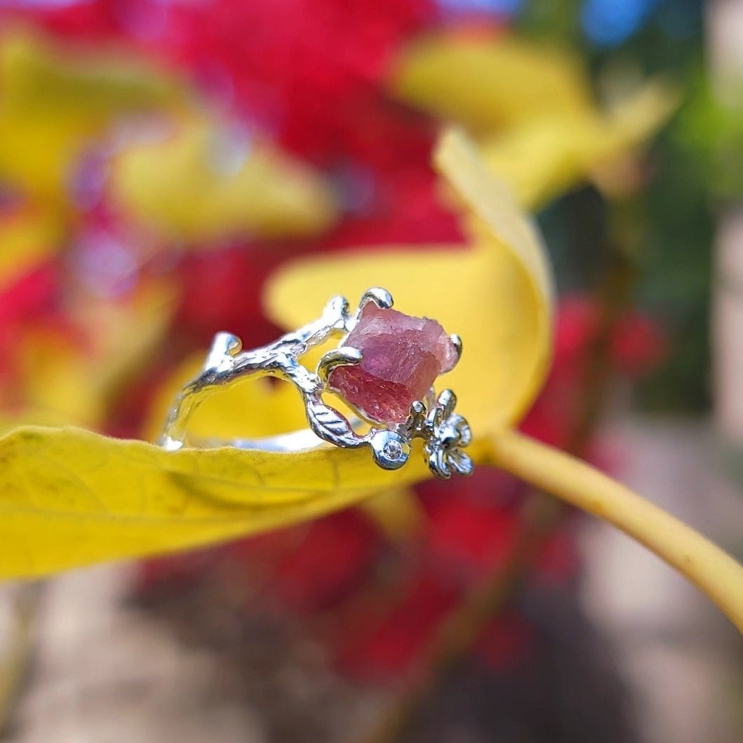 silver ring with natural raw tourmaline and small zircon branch leaf and flower adjustable ring on leaf.