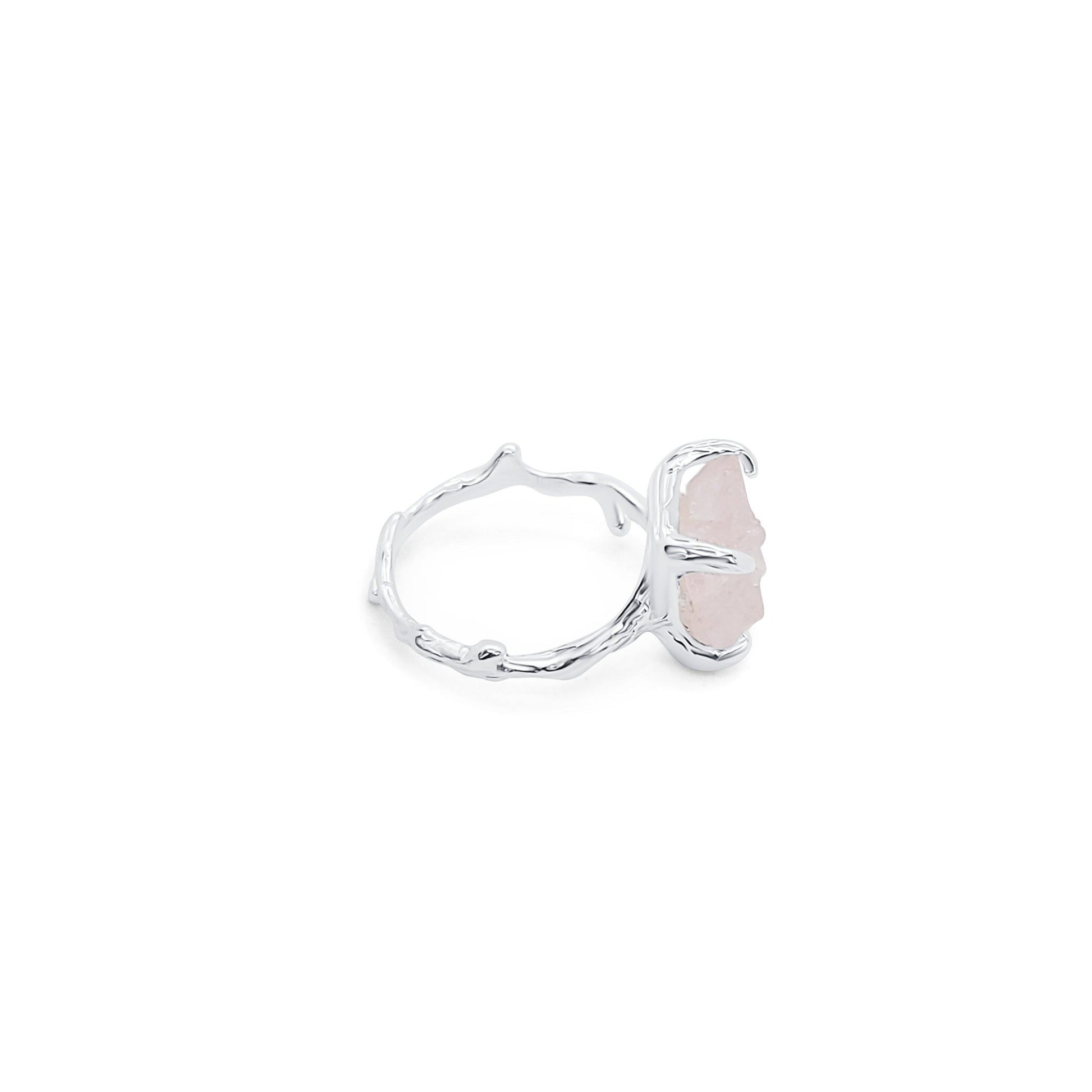 side view of adjustable silver and natural rose quartz ring with branch inspired design