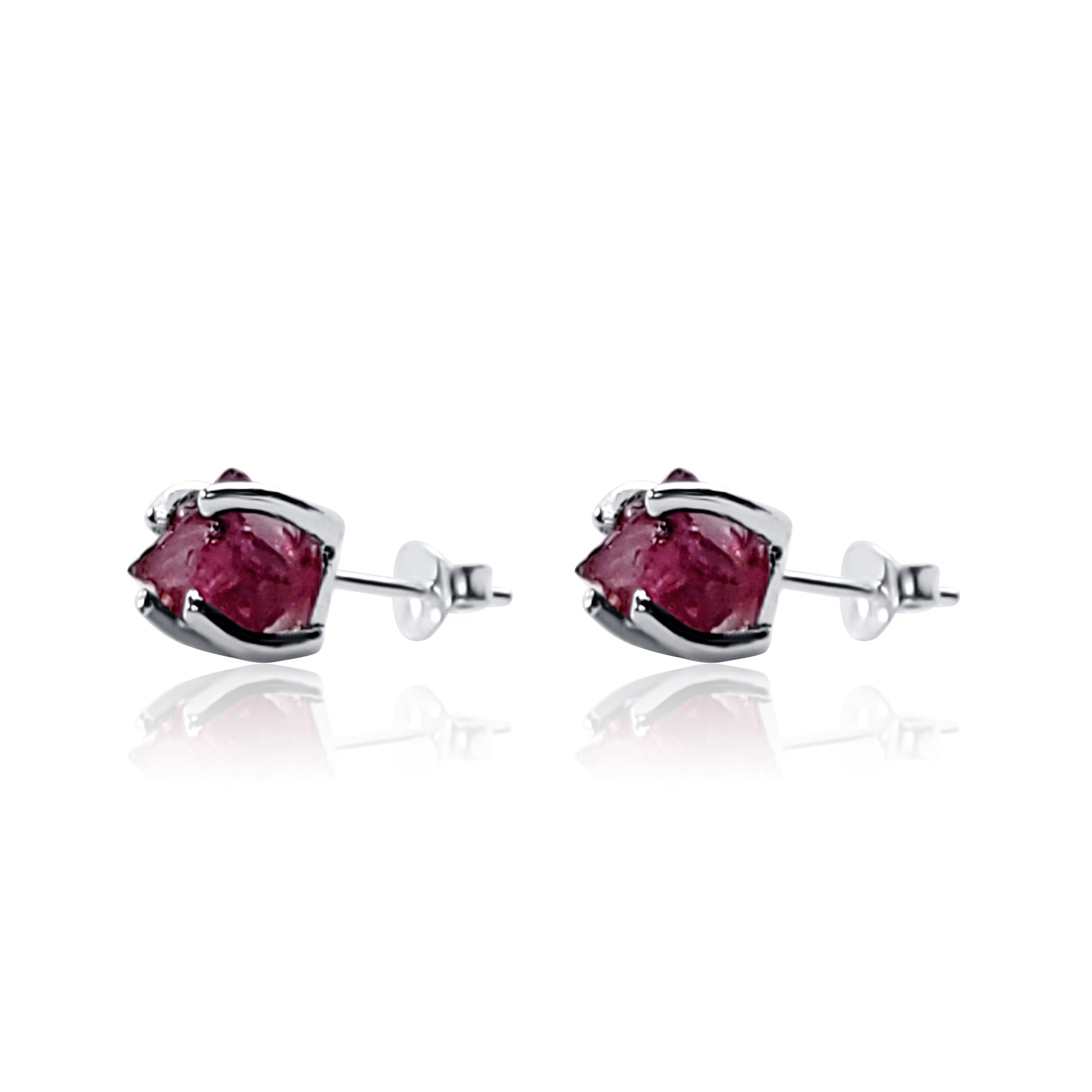 side view of raw garnet crystal silver stud earrings with prong setting
